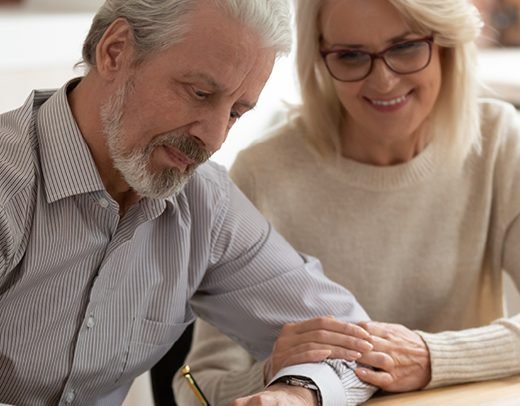 old couple signing on legal documents